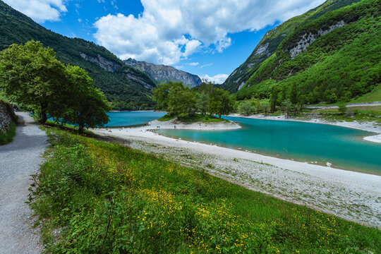 The view of Lake Tenno, a splendid alpine lake nestled between mountains and woods, near Lake Garda, near the town of Tenno, Trentino, Italy - May 2026
