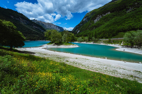 The view of Lake Tenno, a splendid alpine lake nestled between mountains and woods, near Lake Garda, near the town of Tenno, Trentino, Italy - May 2026
