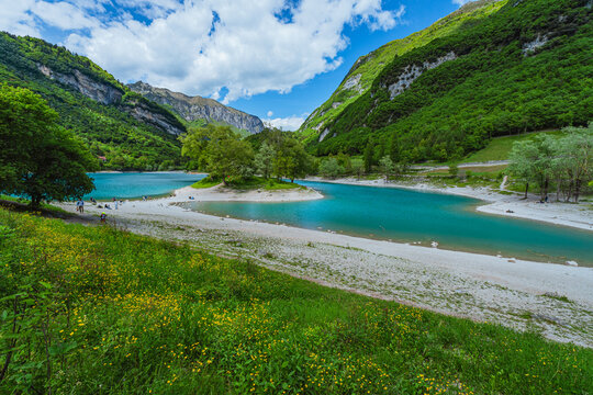 The view of Lake Tenno, a splendid alpine lake nestled between mountains and woods, near Lake Garda, near the town of Tenno, Trentino, Italy - May 2026