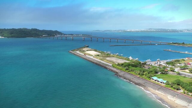 Aerial view of a bridge in the turquoise sea, Okinawa, Japan.	