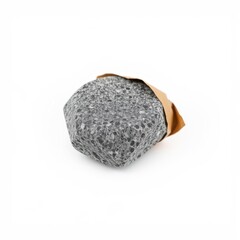 Fototapeta premium Gray solid shampoo bar partially wrapped in brown paper. Minimalist product presentation, clean background, simple composition.