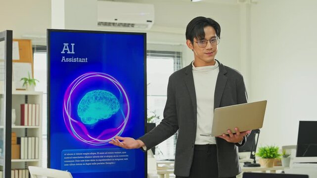 Smart Asian businessman presenting AI backend system replacing human marketing data management to partners and programmers in modern open office, business restructuring and automation concept