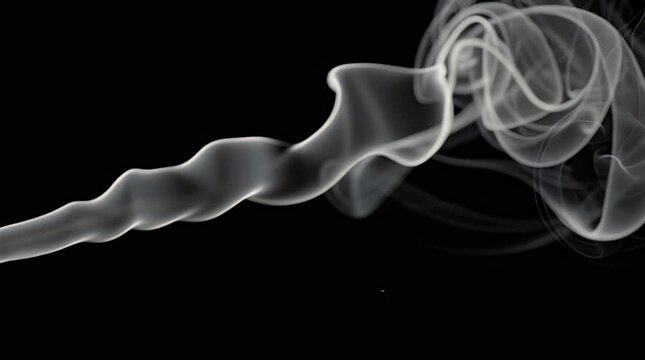 Smoke swirling on black background.