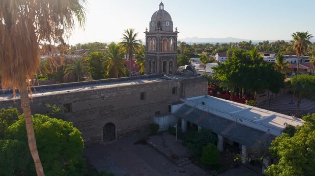 Watch the sunrise illuminate the Loreto Mission church in Baja California Sur, Mexico from aerial views highlighting the historic structure