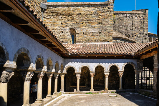Osona, Spain - June 27, 2026: Tourists visiting Romanesque cloister. Vic, Spain