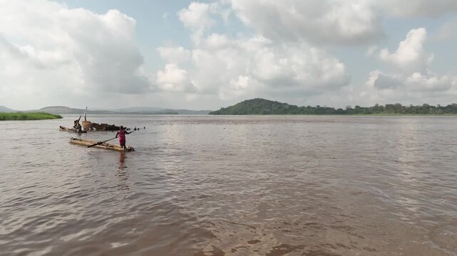Congo River, DR Congo - traditional dugout canoes and fishermen, aerial drone view