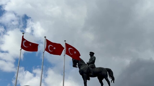 The Atat&uuml;rk statue and the waving Turkish flag in Ulus, Ankara, Turkey. Turkish national holidays. 4k video.
