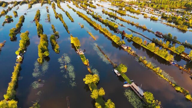 Aerial drone view the harbour of Scheendijk Loosdrechtse Plassen, a floating village in the Netherlands at sunset. High quality 4k footage