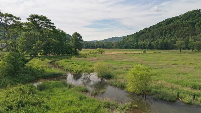 Scenic Drone Shot of Dutch Creek in Valle Crucis, Winding Through a Green Valley in Watauga County, North Carolina, USA. June 5, 2026.