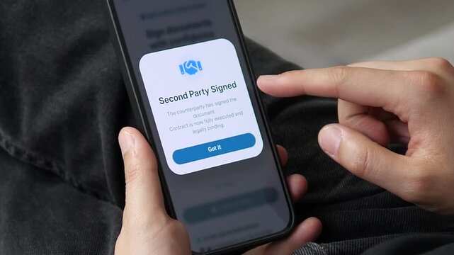Mobile app screen confirming contract execution with both parties signed. Clear message about legally binding status. Ideal for videos about digital contracts, e-signatures, and business deal finaliza