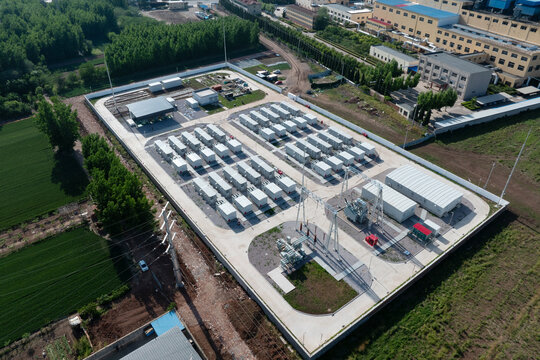 Aerial view of a large-scale energy storage power station with battery arrays and supporting infrastructure
