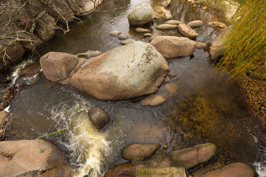 overhead view of boulders and stream