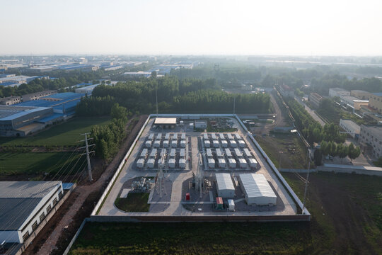 Aerial view of a large-scale energy storage power station with industrial facilities and battery arrays