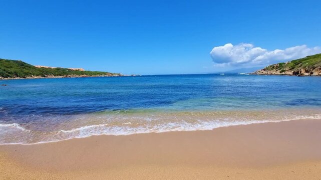 Beautiful turquoise sea and golden sand on La Licciola beach, in sunny summer day, in Sardinia, Italy, top view