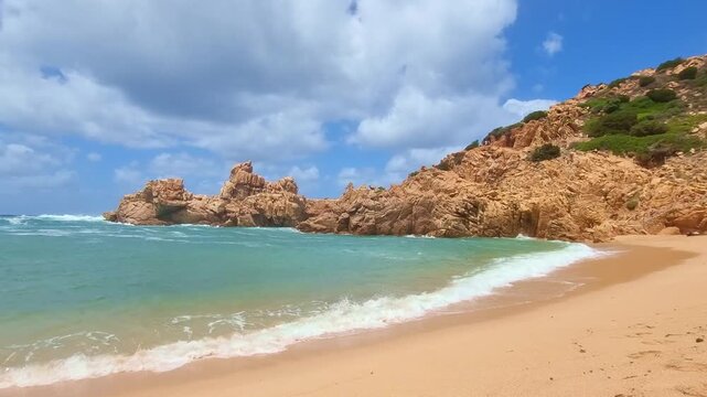 Beautiful turquoise sea, rocks and golden sand on Li Cossi beach, in sunny summer day, in Sardinia, Italy