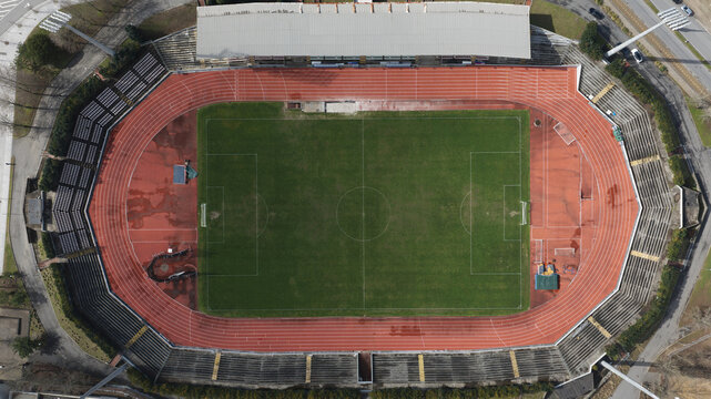 Maia, Porto, Portugal - 24 June 2026: Aerial view of Stadium Jose Vieira de Carvalho with its green pitch and red running track surrounded by seating tiers.