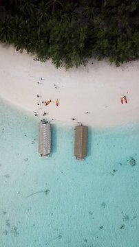 Traditional style Polynesian raft boats in lagoon, clear turquoise water in the pacific islands