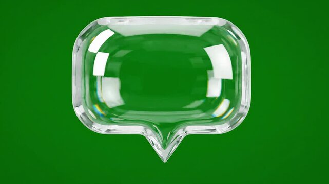 Closeup of a transparent glass speech bubble on a vibrant green background