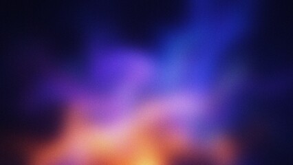 Abstract glowing nebula with vibrant orange and blue hues against a dark background with soft focus © CreativeArtnest