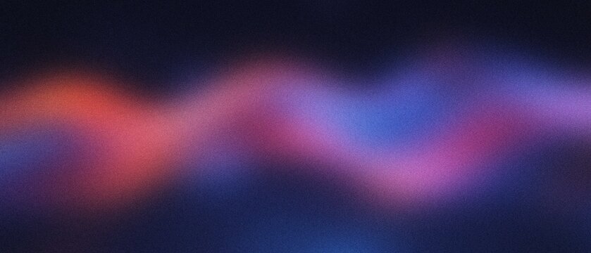 Abstract wavy gradient blend of red and blue light against a dark background with soft focus