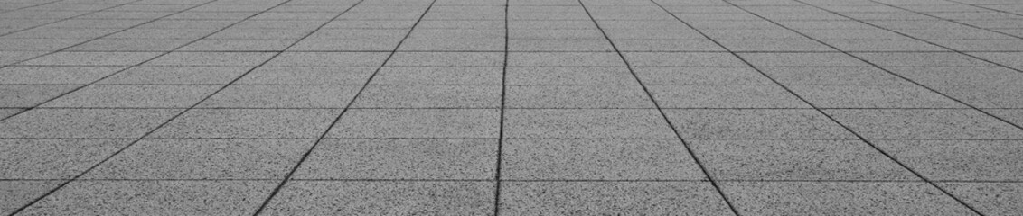 Fototapeta premium empty stone floor top in perspective. grey tile floor background in perspective view. line. empty copy space stone street. pavement. Granite outdoor tiled floor. gray granite. Marble texture