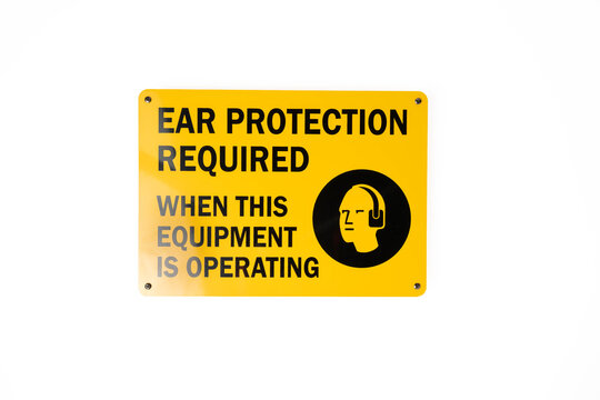 Yellow and black ear protection required sign on white background