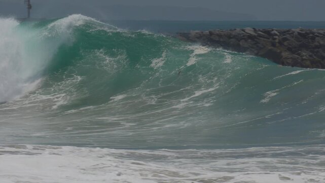 Perfect big barrel breaking at the wedge