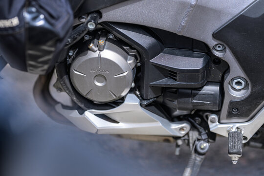 Varberg, Sweden - May 14 2026: Honda motorcycle engine cover and foot peg mechanical detail.