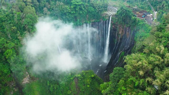 Drone flight footage of stunning Tumpak Sewu waterfall, East Java, Indonesia
