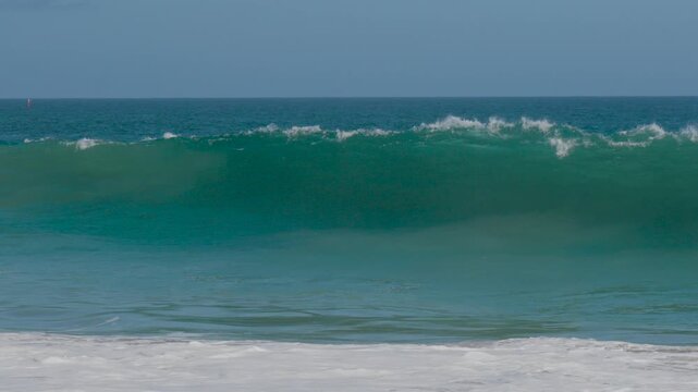 wave crashing and exploding on the beach