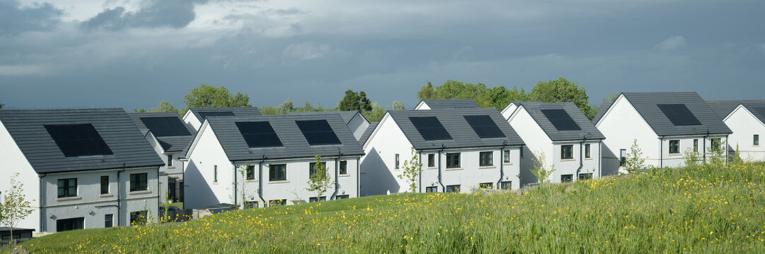Solar panels installed on home roofs at new housing development
