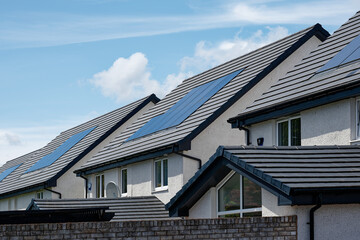 Solar panels installed on home roofs at new housing development © Richard Johnson