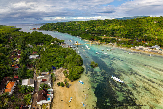 Aerial view of boats anchored in the turquoise waters of Nusa Lembongan, Indonesia