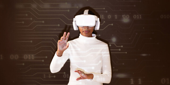 Woman using virtual reality headset with futuristic digital interface