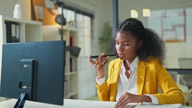 Close up African American female analyst using AI agent on laptop for business planning at night office, artificial intelligence assistant supporting corporate strategy, future of work concept