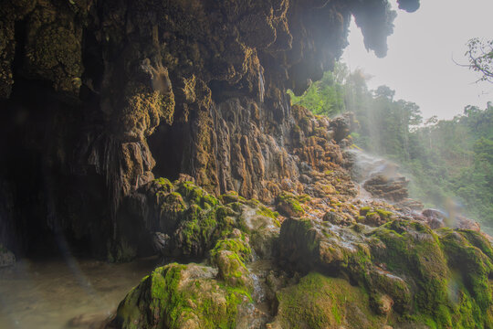 Clear water pool inside Goa Tetes limestone cave at Tumpak Sewu canyon Indonesia