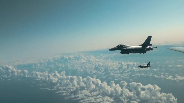 Two F16 fighter jet military aircraft posing in formation in 4K Ultra HD footage
