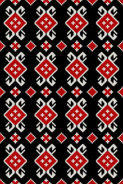 Seamless Ukrainian folk ornament with red diamond motifs on black