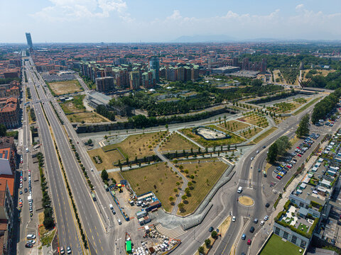 Aerial view of Parco Dora featuring green spaces, walking paths, urban infrastructure, and surrounding residential buildings in Turin, Piedmont, Italy.