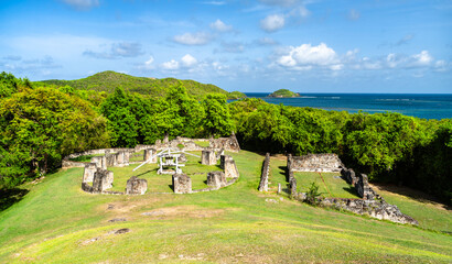 The historic ruins of Chateau Dubuc on the scenic Caravelle Peninsula in Martinique surrounded by lush green nature and the blue ocean