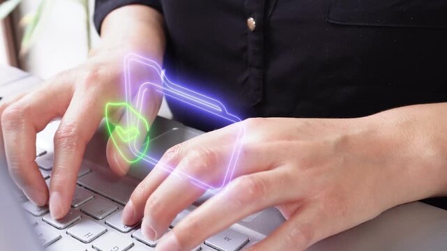 Document security. Close-up of a professional woman interacting with her computer, featuring a virtual folder icon and a shield with a checkmark inside.