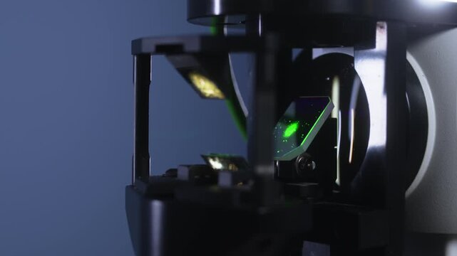 Ophthalmic laser equipment shows sequential laser beam adjustments and component alignments during preparation in a clinical setting with focused lighting
