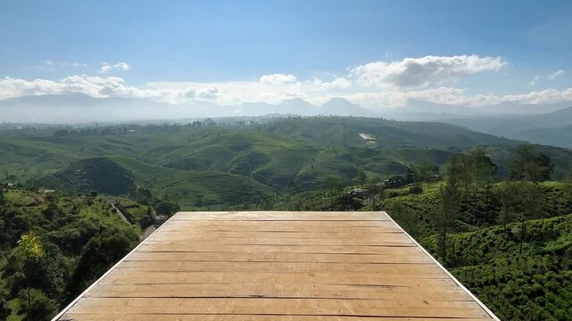 Pangalengan, Bandung, West Java - Indonesia: July 5, 2026: A morning mountain view featuring an open area for sitting or taking photos.