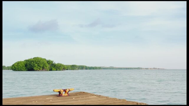 Time lapse of a dock, sea and clouds at Bahia Salinas, Cabo Rojo, Puerto Rico.