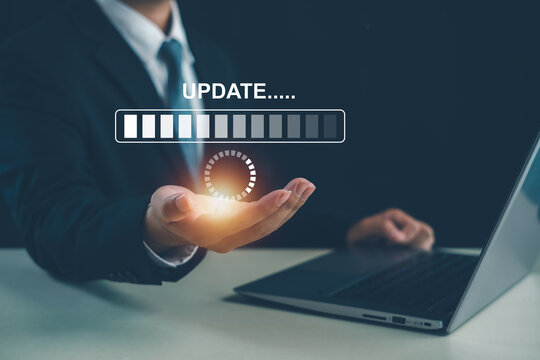 Business professional managing software updates and system upgrades on a digital platform, highlighting technology maintenance, cybersecurity patches, performance optimization, and IT management.