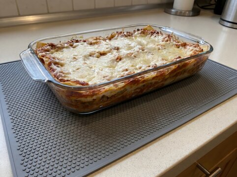 Fresh Homemade Baked Lasagna In Glass Casserole Dish On Kitchen Counter