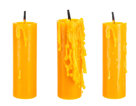 Three yellow melted candles with burned wicks and glossy wax drips, decorative candle set for ritual and home decor on isolated background