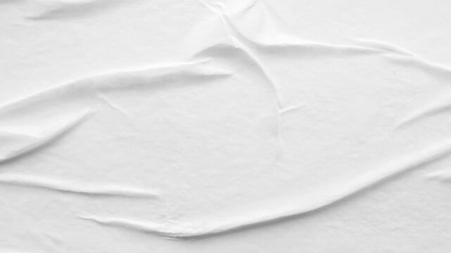 white crumpled and creased glued wrinkled paper poster texture background stop motion