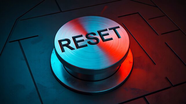 Metal reset button representing system restart recovery and technology concept