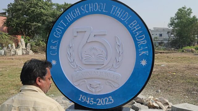 Indian Stone Sculpture Artist Hand Painting Platinum Jubilee School Logo Sculpture, Traditional Stone Craftsmanship, Artisan at Work, Odisha India